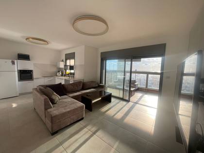 A large living room with a view in a group apartment in Akko